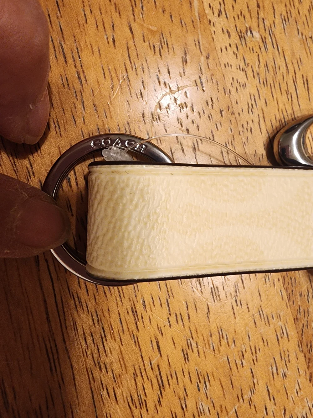 Coach Trigger Snap Bag Charm in Signature Canvas featuring a sleek Beige/silver